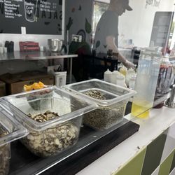 TOSS - Salads & Wraps - At the end you have your choice of crunchies as they call them to add to your salad ex. Croutons, sunflower seeds, nuts etc.