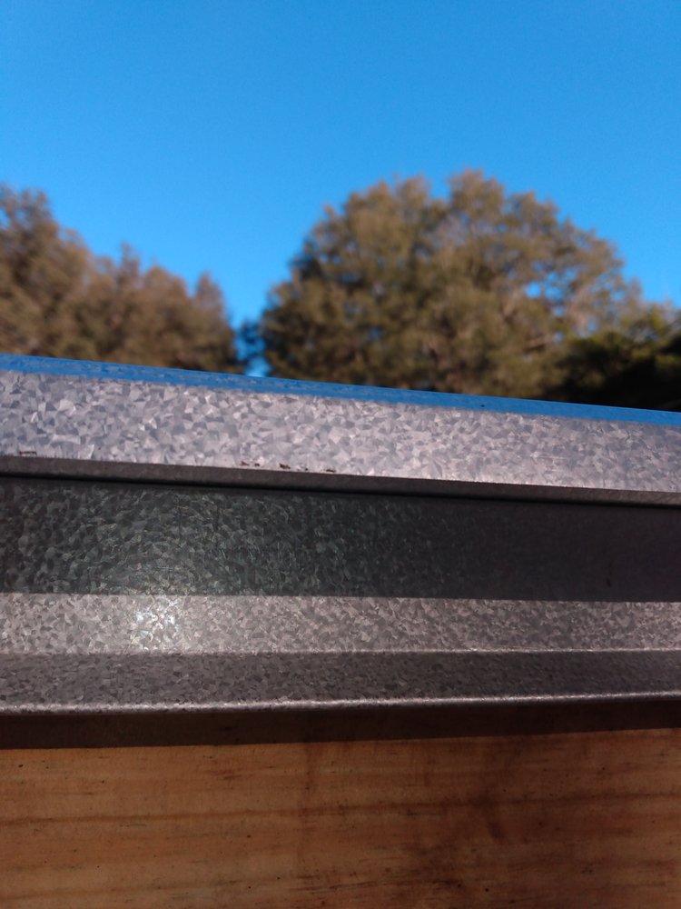 Slide of UnZucky Roofing