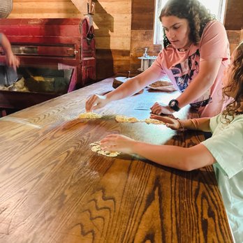 Bonneyville Mill County Park - Showing the kids what the wheat is like when milled - Parks Near Me - Bristol, Indiana