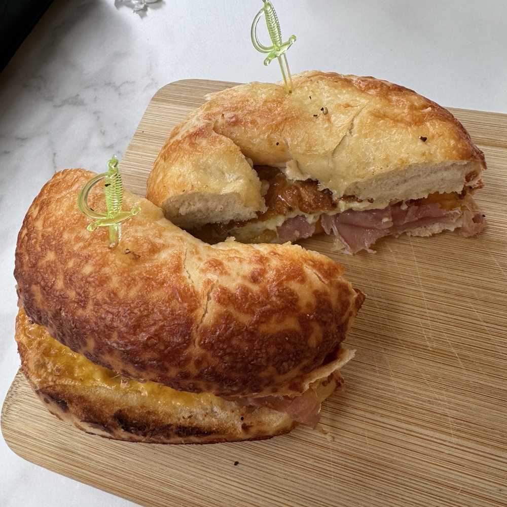 Prosciutto, cheddar, and egg on an Asiago bagel Prosciutto, cheddar, and egg on an Asiago bagel