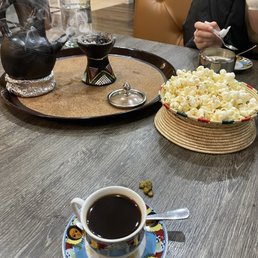 Cafe jebena with incense and the Jebena used to brew the coffee Cafe jebena with incense and the Jebena used to brew the coffee
