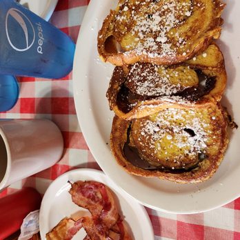 Clockers Cafe - Cinnamon roll French toast with a side of bacon - American Near Me - Branson, Missouri