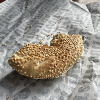 Le Trou - Sesame bagel with cream cheese fresh out of wood fired oven. - Bagels Near Me - Montreal, Quebec