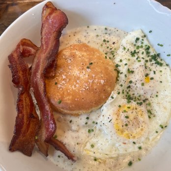 Gracious Plenty Bakery & Breakfast - Biscuit & Gravy w/ side of bacon and eggs over medium. - Bakeries Near Me - Roswell, Georgia Gracious Plenty Bakery & Breakfast - Biscuit & Gravy w/ side of bacon and eggs over medium. - Bakeries Near Me - Roswell, Georgia