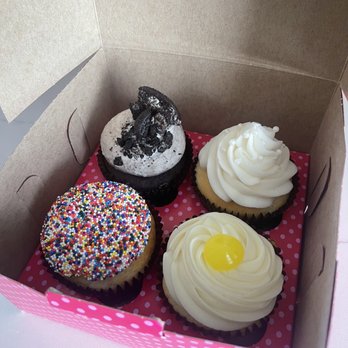 Smallcakes Cupcakery - Top left Cookies and Cookies-n-Cream Cupcake, then Wedding Cake Cupcake. Bottom left Birthday Cake Cupcake and then the Lemon Drop Cupcake - Cupcakes Near Me - Ripon, California