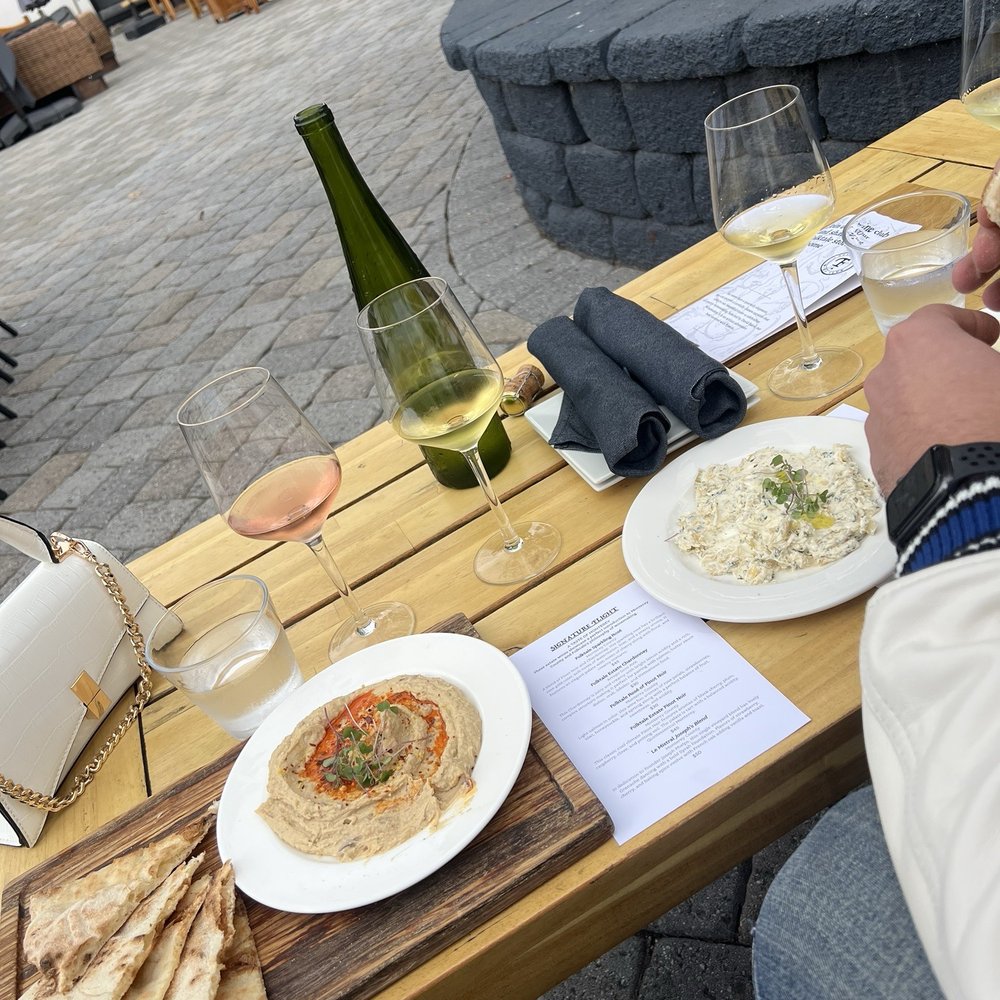Folktale Winery - Hummus and artichoke dip paired with reserve flight and signature flight - Wineries Near Me - Carmel, California Folktale Winery - Hummus and artichoke dip paired with reserve flight and signature flight - Wineries Near Me - Carmel, California