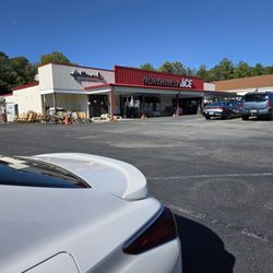 Northwest Ace Hardware - My pearl white Lexus parked in their parking lot with the Ace Hardware store and Hallmark Gold Crown signs in the background.