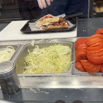 Jersey Mike's Subs - My gluten-free sub being created on a clean tray with a clean knife. And fresh gloves. - Sandwiches Near Me - Palmer, Massachusetts Jersey Mike's Subs - My gluten-free sub being created on a clean tray with a clean knife. And fresh gloves. - Sandwiches Near Me - Palmer, Massachusetts