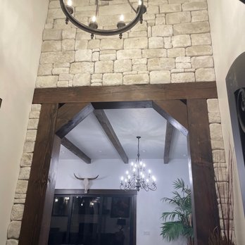 Pruitts Carpentry - a living room with a chandelier - General Contractors Near Me - New Plymouth, Idaho