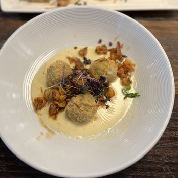 Spoke & Hub - Seafood stuffed eggplant ball with hollandaise. - Breakfast & Brunch Near Me - Baton Rouge, Louisiana Spoke & Hub - Seafood stuffed eggplant ball with hollandaise. - Breakfast & Brunch Near Me - Baton Rouge, Louisiana