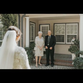 Evanshire Gardens - Near the greenery, behind the people is where the house the bridal room is in - Venues & Event Spaces Near Me - Ceres, California