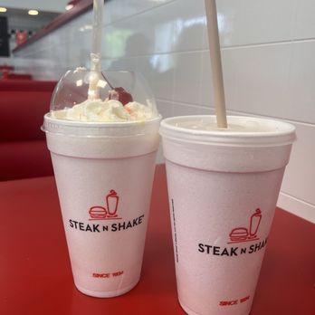 Steak ’n Shake - Steak & Shake - Banana shake with whipped cream and cherry and a Chocolate shake - Fast Food Near Me - Tallahassee, Florida Steak ’n Shake - Steak & Shake - Banana shake with whipped cream and cherry and a Chocolate shake - Fast Food Near Me - Tallahassee, Florida
