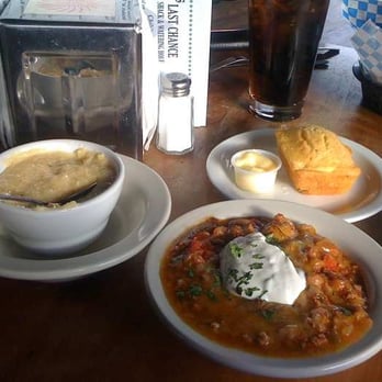 Slim's Last Chance - Turkey and white bean chili, white cheddar grits, and cornbread with honey butter - Bars Near Me - Seattle, Washington Slim's Last Chance - Turkey and white bean chili, white cheddar grits, and cornbread with honey butter - Bars Near Me - Seattle, Washington