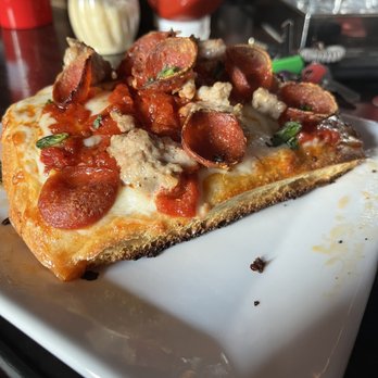 The Hi-Hat - a slice of pizza on a plate - Bars Near Me - St. Louis, Missouri The Hi-Hat - a slice of pizza on a plate - Bars Near Me - St. Louis, Missouri