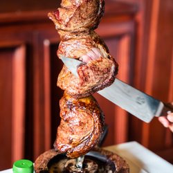 Rei Do Gado Brazilian Steakhouse - Picanha Skewer being carved table side
