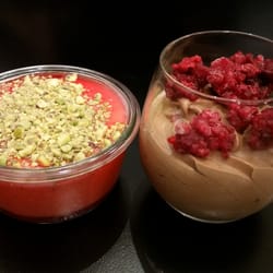 Tavlin - Malabi - Rosewater Panna Cotta with Rose Syrup and Chopped Pistachio. Hazelnut Mousse Topped with Raspberry.