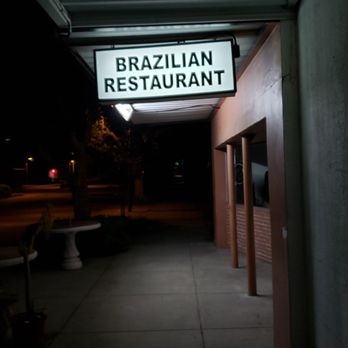 Cantinho Brasileiro Sabor Mineiro - Nighttime shot of the sign over the sidewalk - Brazilian Near Me - Myrtle Beach, South Carolina Cantinho Brasileiro Sabor Mineiro - Nighttime shot of the sign over the sidewalk - Brazilian Near Me - Myrtle Beach, South Carolina