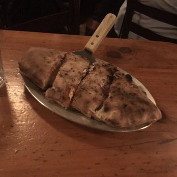 Lucali - Calzone. Comes with a side of marinara. Not too bready like a lot of calzones can be! - Pizza Near Me - Brooklyn, New York Lucali - Calzone. Comes with a side of marinara. Not too bready like a lot of calzones can be! - Pizza Near Me - Brooklyn, New York