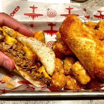 AJ Bombers - Went with the Cheese on Cheese on Cheese - Regular, some Buffalo Egg Rolls and Tater Tots. - Burgers Near Me - Milwaukee, Wisconsin AJ Bombers - Went with the Cheese on Cheese on Cheese - Regular, some Buffalo Egg Rolls and Tater Tots. - Burgers Near Me - Milwaukee, Wisconsin