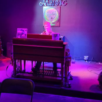 Herb's Hideout - a stage with a piano and a keyboard - Lounges Near Me - Denver, Colorado