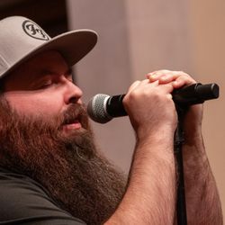 K Voice Studio - Nick (He/Him) sings Foo Fighters at the Spring 2024 recital. Photo by Queer Lenz Photography.