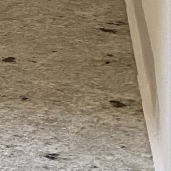 Tops Countertops - Uneven cut so far from the edge that floating the tile with an extra bead across the bottom almost didn't cover. - Countertop Installation Near Me - Lacey, Washington