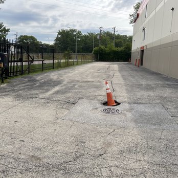 Public Storage - Potholes keep getting bigger and this is their facility maintenance in the path to get to the building door. - Self Storage Near Me - Alsip, Illinois Public Storage - Potholes keep getting bigger and this is their facility maintenance in the path to get to the building door. - Self Storage Near Me - Alsip, Illinois