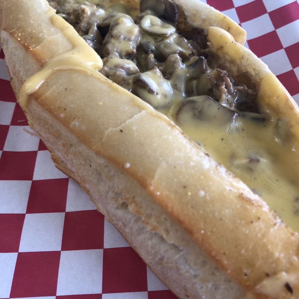 West Coast Cheesesteaks - West Coast Cheesesteak (steak, cheddar cheese sauce, grilled onions, bell peppers, mushrooms, and jalapeños) - Cheesesteaks Near Me - Glendora, California West Coast Cheesesteaks - West Coast Cheesesteak (steak, cheddar cheese sauce, grilled onions, bell peppers, mushrooms, and jalapeños) - Cheesesteaks Near Me - Glendora, California