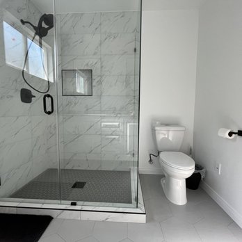 Hic Builders - a bathroom with a shower and toilet - General Contractors Near Me - Sherman Oaks, California