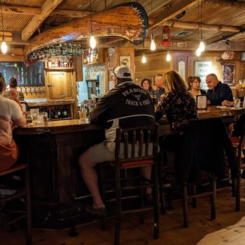 Camp - a group of people sitting at a bar - New American Near Me - Meredith, New Hampshire Camp - a group of people sitting at a bar - New American Near Me - Meredith, New Hampshire