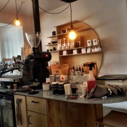 Frank's Eats - Decor is mix of minimal with glass and early century pieces. It's just lovely. there's a red rabbit logo outside -- Donnie Darko?