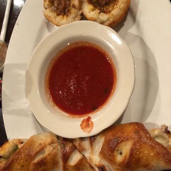 Cascarino's - a plate of pastries and a bowl of sauce - Pizza Near Me - Montgomery, New York Cascarino's - a plate of pastries and a bowl of sauce - Pizza Near Me - Montgomery, New York