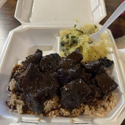 Jerk pork with rice and beans. Side of cabbage.