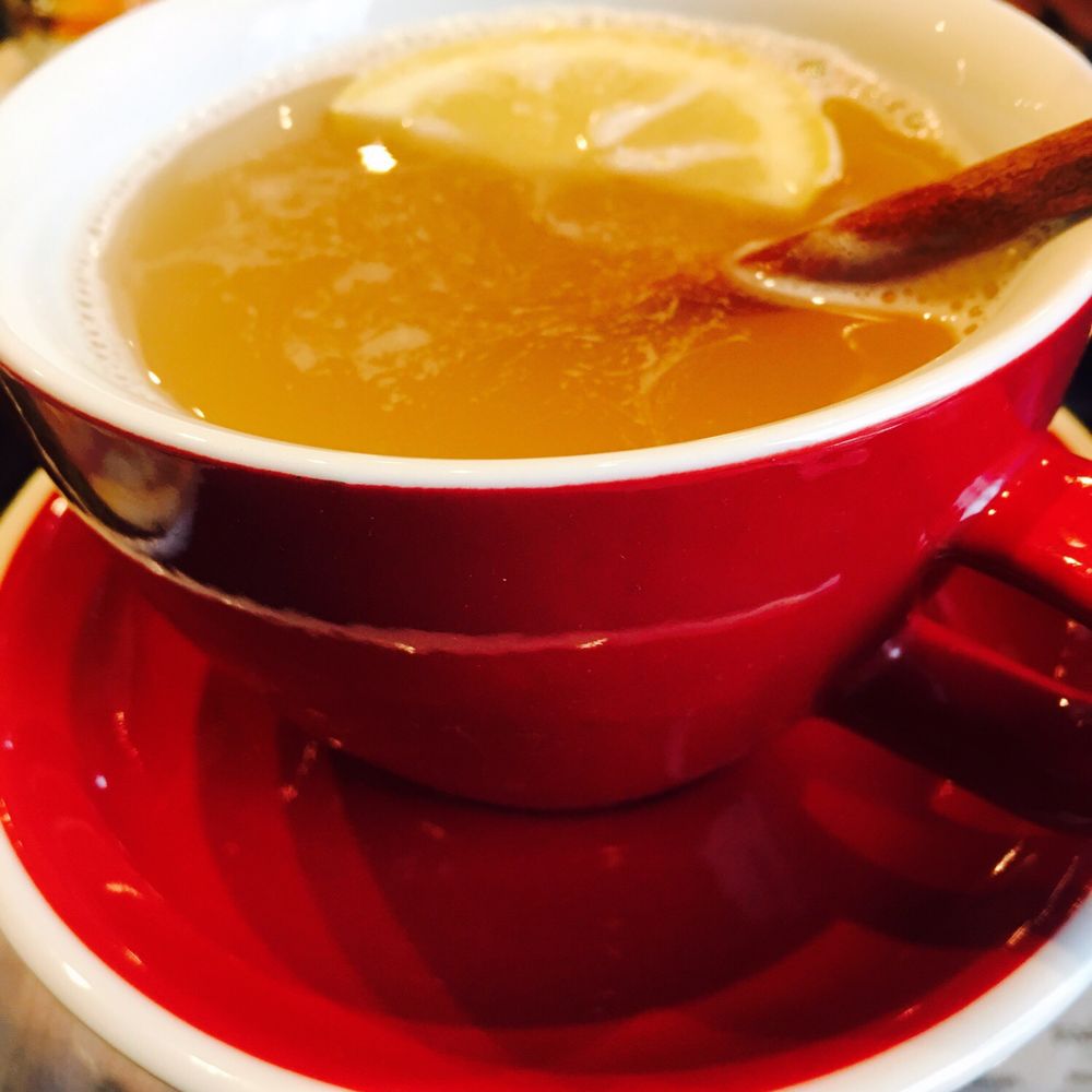 Hot toddy served with lemon and cinnamon stick