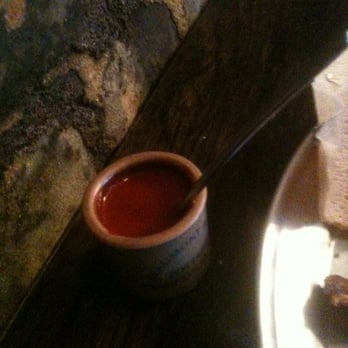 Bati Ethiopian Kitchen  - Clarified butter with herbs (hot sauce if u will but not really hot but flavorful.) - Ethiopian Near Me - Brooklyn, New York