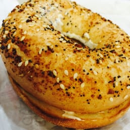  a bagel covered in sesame seeds