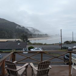 Ocean Cove Inn - Deck immediately outside Alsea. The 101 runs between the hotel and the bay.
