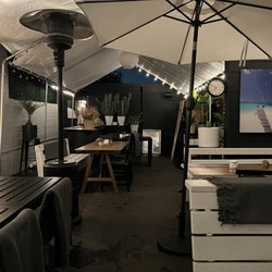 Kustaa Cheese & Wine - Outdoor patio with tents, umbrellas, and heaters. Very cozy!