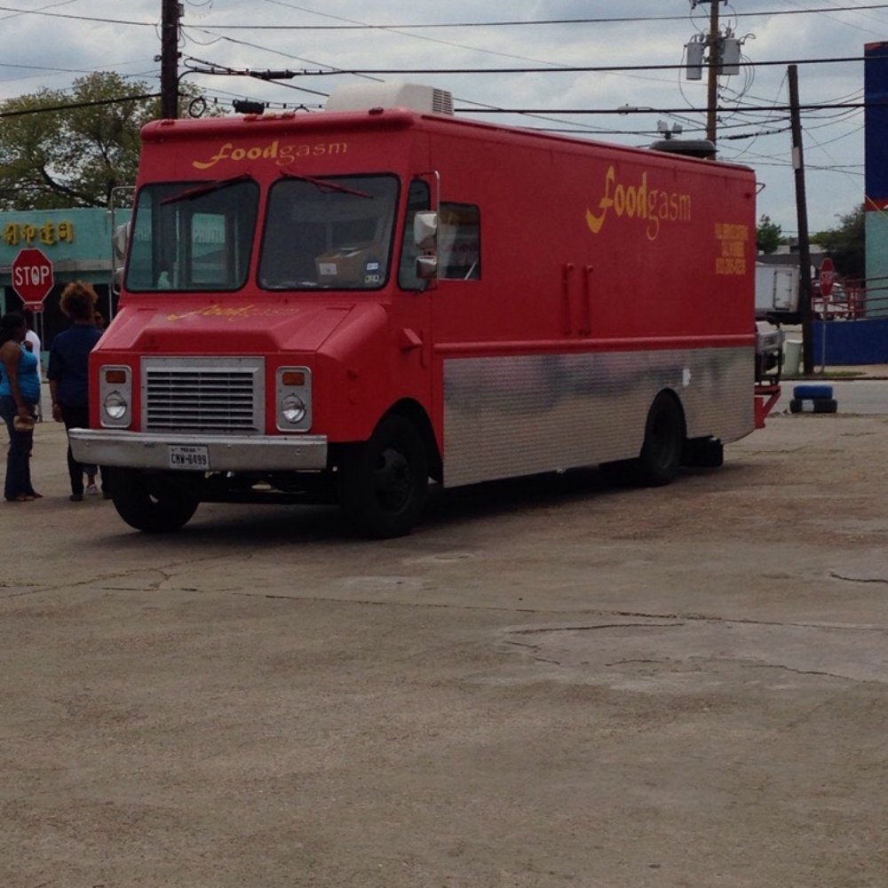 Foodgasm - a red food truck parked in a parking lot - Food Trucks Near Me - Houston, Texas