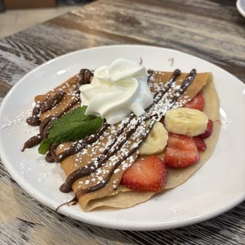 Lala's Waffles Crepes Shakes - Nutella crepe that came in the crepe combo. Inside has strawberries & banana Yummy! - Breakfast & Brunch Near Me - Indio, California Lala's Waffles Crepes Shakes - Nutella crepe that came in the crepe combo. Inside has strawberries & banana Yummy! - Breakfast & Brunch Near Me - Indio, California