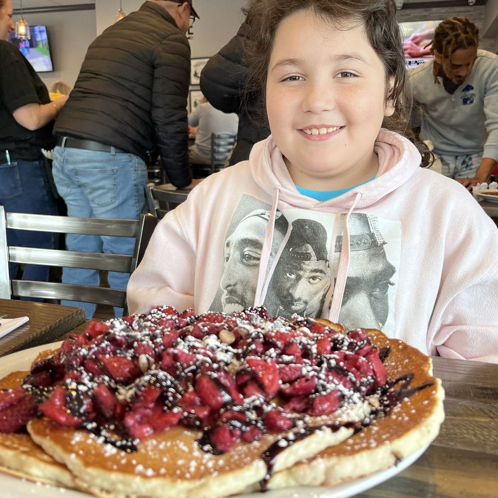City Line Diner - This is the peanut butter chocolate chip pancakes and she added strawberries ! Massive!!! - Breakfast & Brunch Near Me - Worcester, Massachusetts