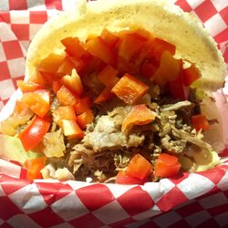 Chez Carlos Café - Arepa con carne: generous two handed portion stuffed with shredded beef, caramelized onions, sautéed mushrooms, cheese, tomatoes, lettuce