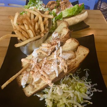 Down the Hatch Maui - Shrimp Po Boy sandwich and lava lava chicken sandwich with Caesar salad side and fries side. - Seafood Near Me - Lahaina, Hawaii