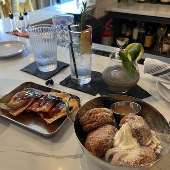 Poor Calvin's - Lobster crawfish Wontons with cavier & truffle balsamic and Beignets with berry compote. Herbal gin &tonic and PHO gin cocktail - Asian Fusion Near Me - Atlanta, Georgia Poor Calvin's - Lobster crawfish Wontons with cavier & truffle balsamic and Beignets with berry compote. Herbal gin &tonic and PHO gin cocktail - Asian Fusion Near Me - Atlanta, Georgia