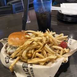 Coaches Burger Bar - The peppercorn burger with a mountain of fries.