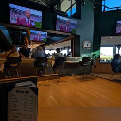 Boosters Bar And Grill - Inside seating , with multiple TVs