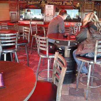 Saints & Sinners - Covered outdoor seating with heatlamps, cool mist fans and big screen tv's - Bars Near Me - Ormond Beach, Florida