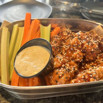 Topgolf - Boneless Asian sesame chicken wing - Golf Near Me - Holtsville, New York Topgolf - Boneless Asian sesame chicken wing - Golf Near Me - Holtsville, New York