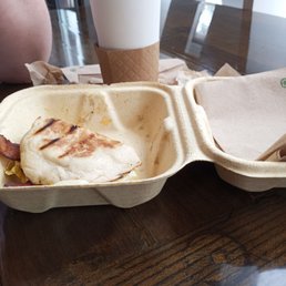 Bacon egg and cheese or at least what's left of it and coffee Bacon egg and cheese or at least what's left of it and coffee