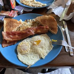 Blossom's Restaurant - Eggs over medium, bacon, hash browns, and toast